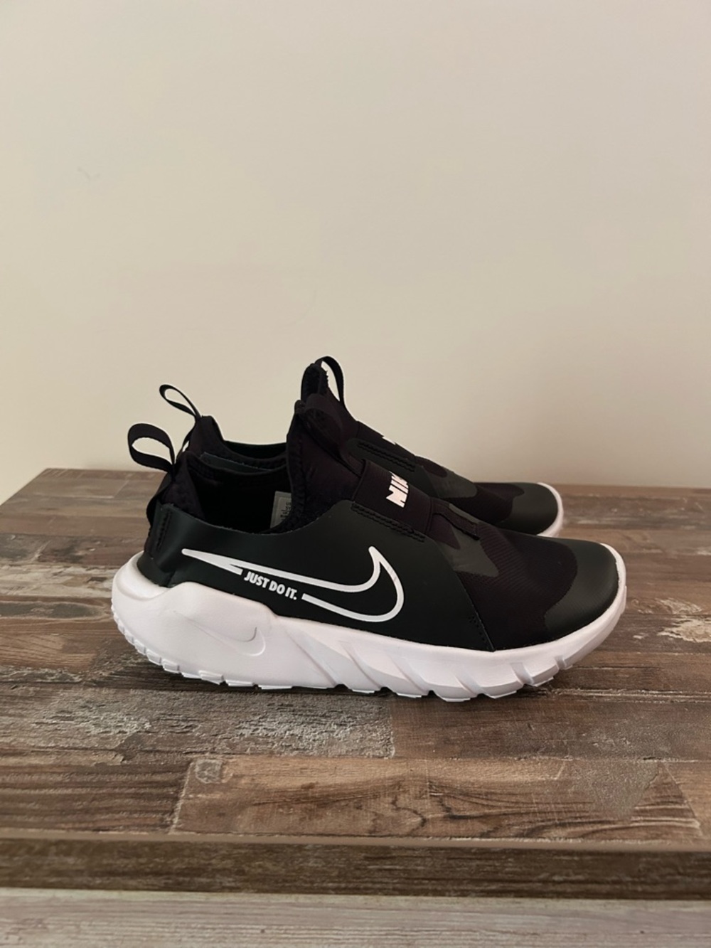 Nike Kids Black and White Slip-On Sneakers with Swoosh